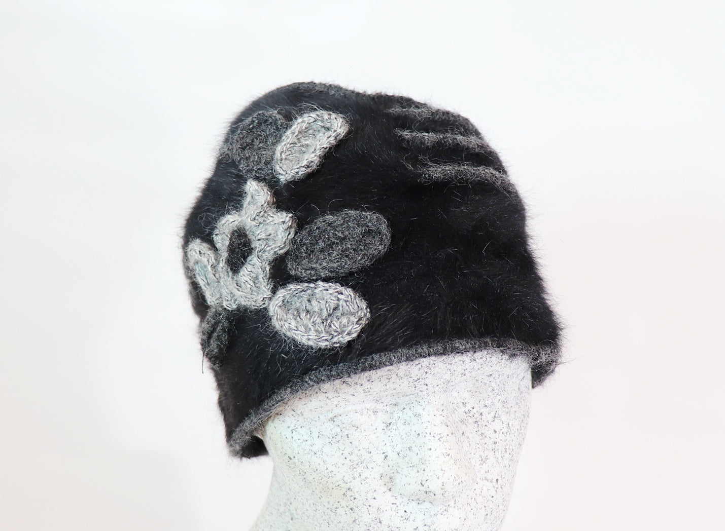 Angora beanie with flowers and piping