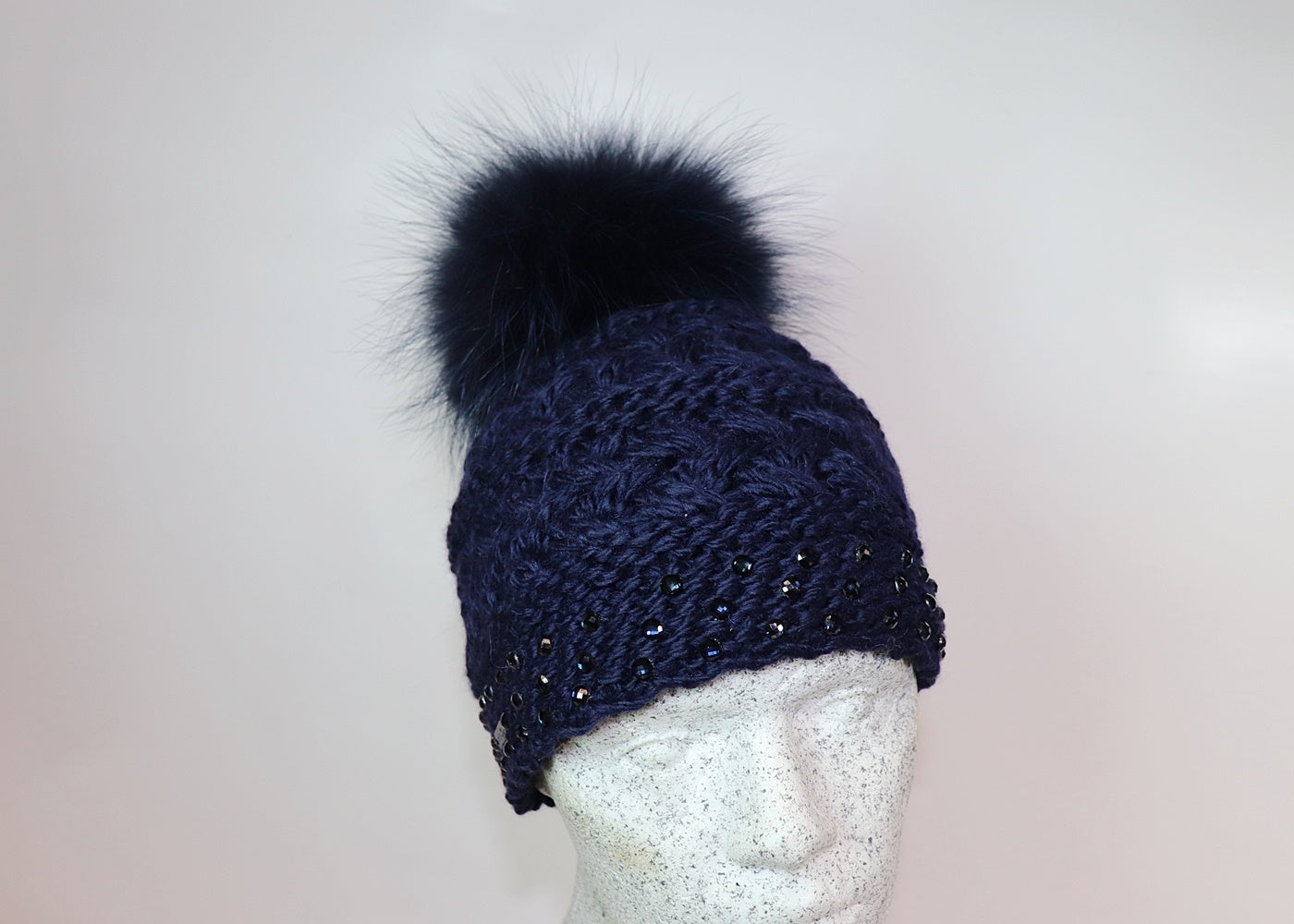 Wool beanie colored diamonds and Finnracoon bobble