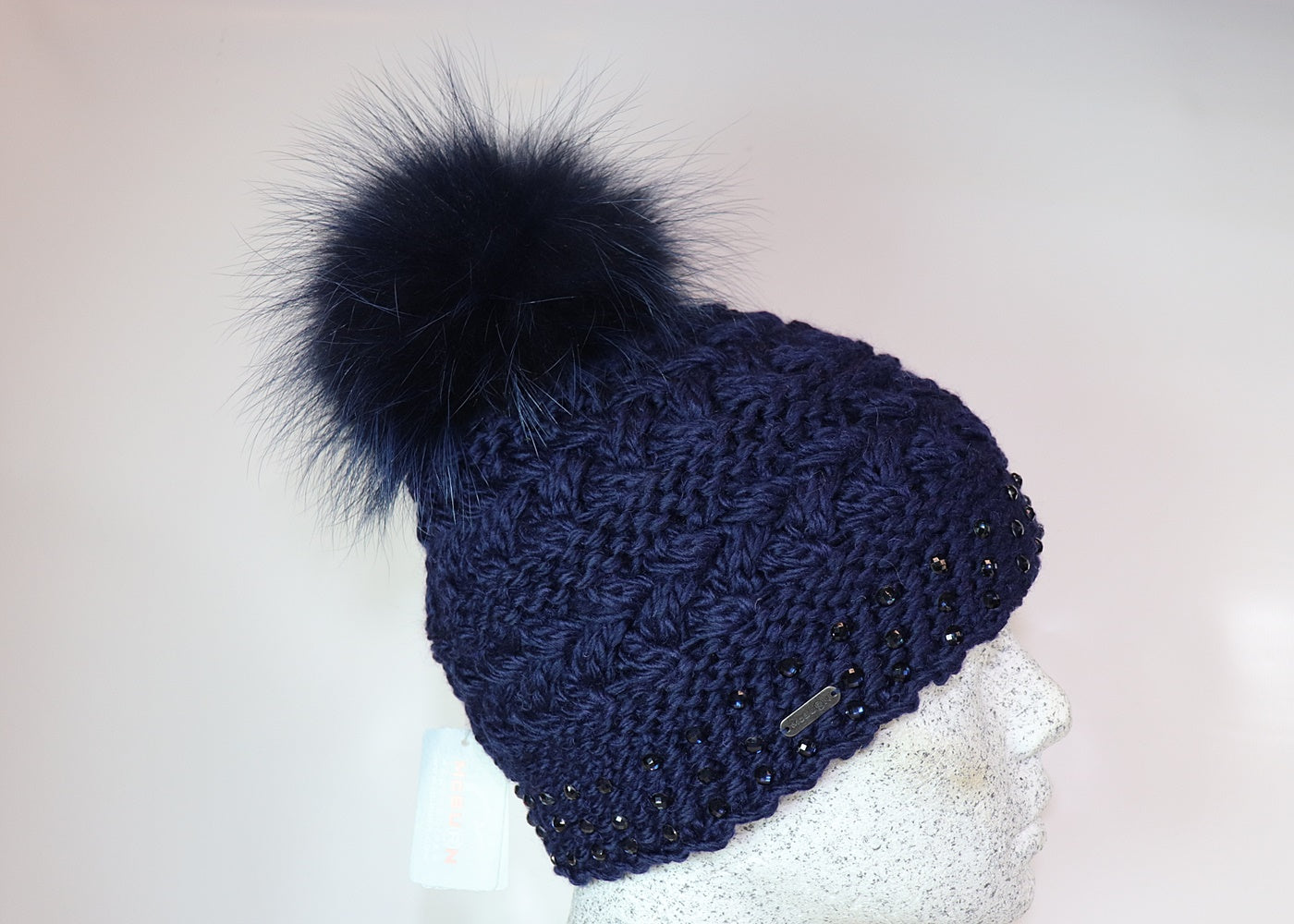Wool beanie colored diamonds and Finnracoon bobble