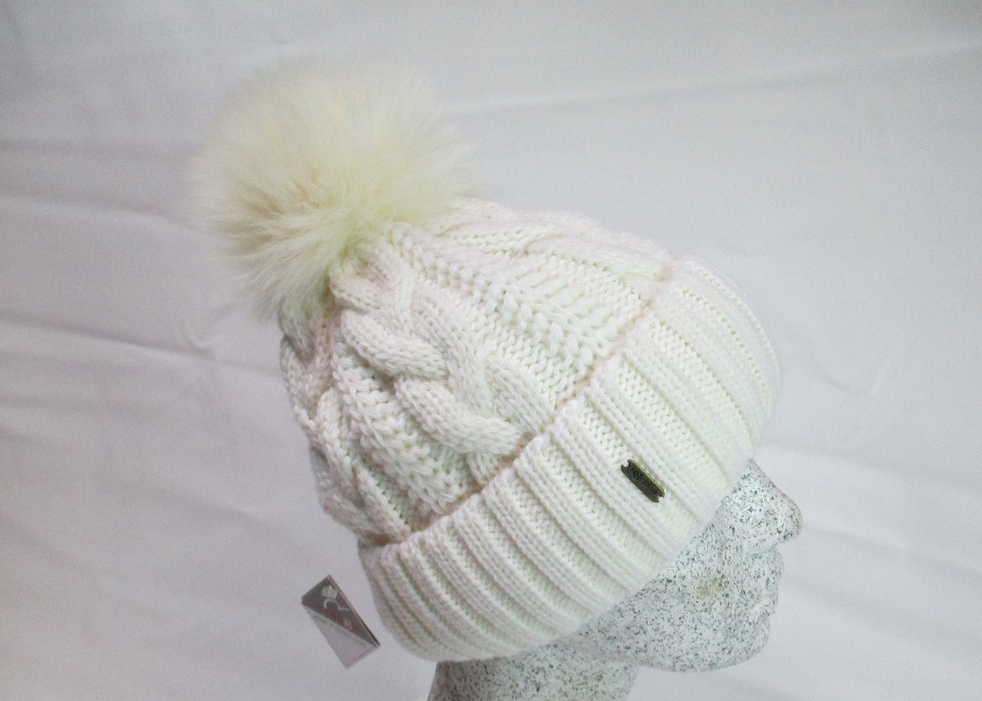 Braided cap with fox pompom